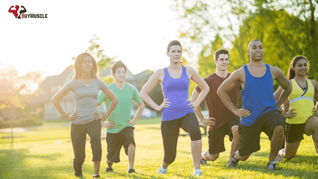 Group of people exercising and training in the park to relieve cortisol
